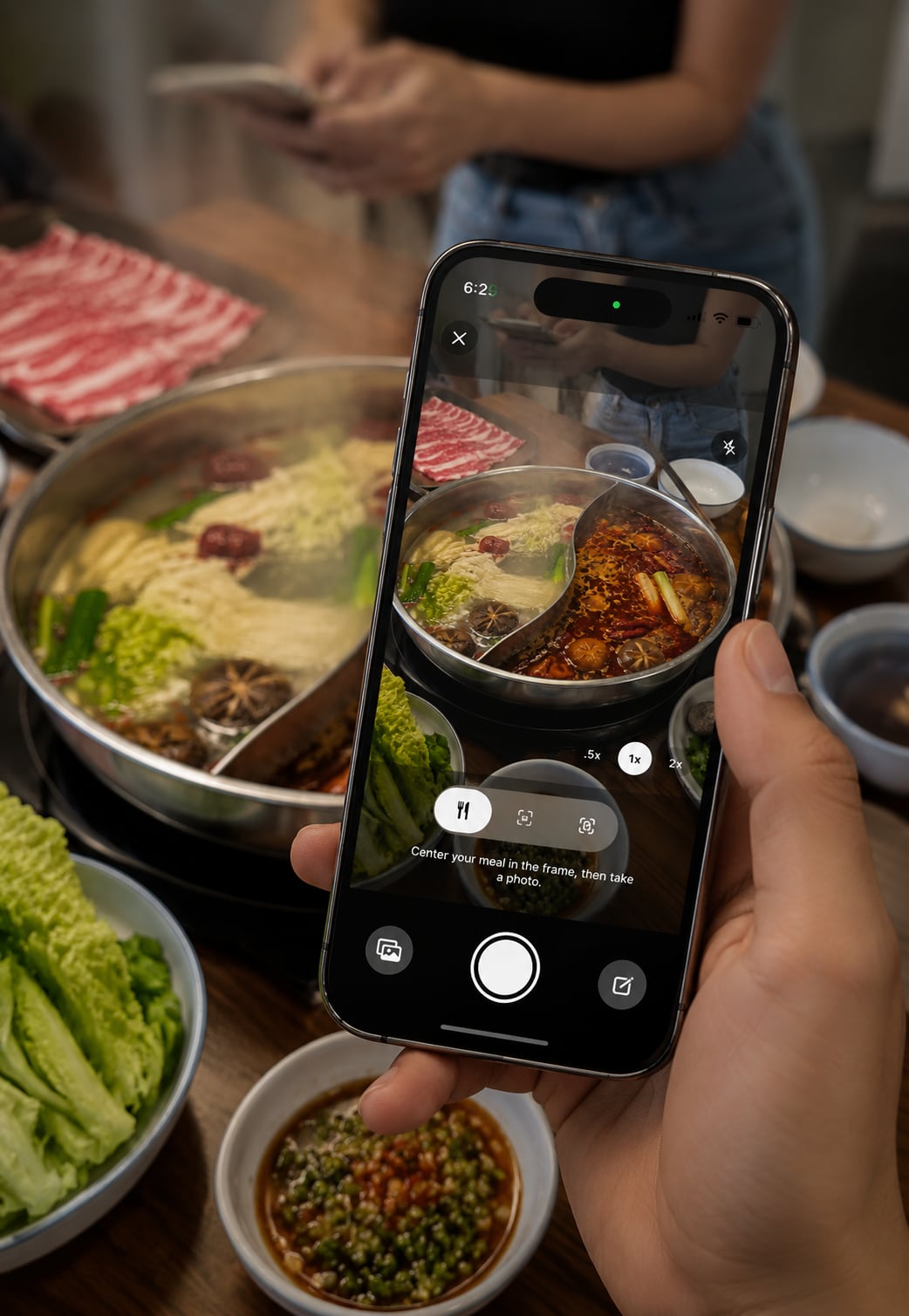 A hot pot at the centre of a shared table