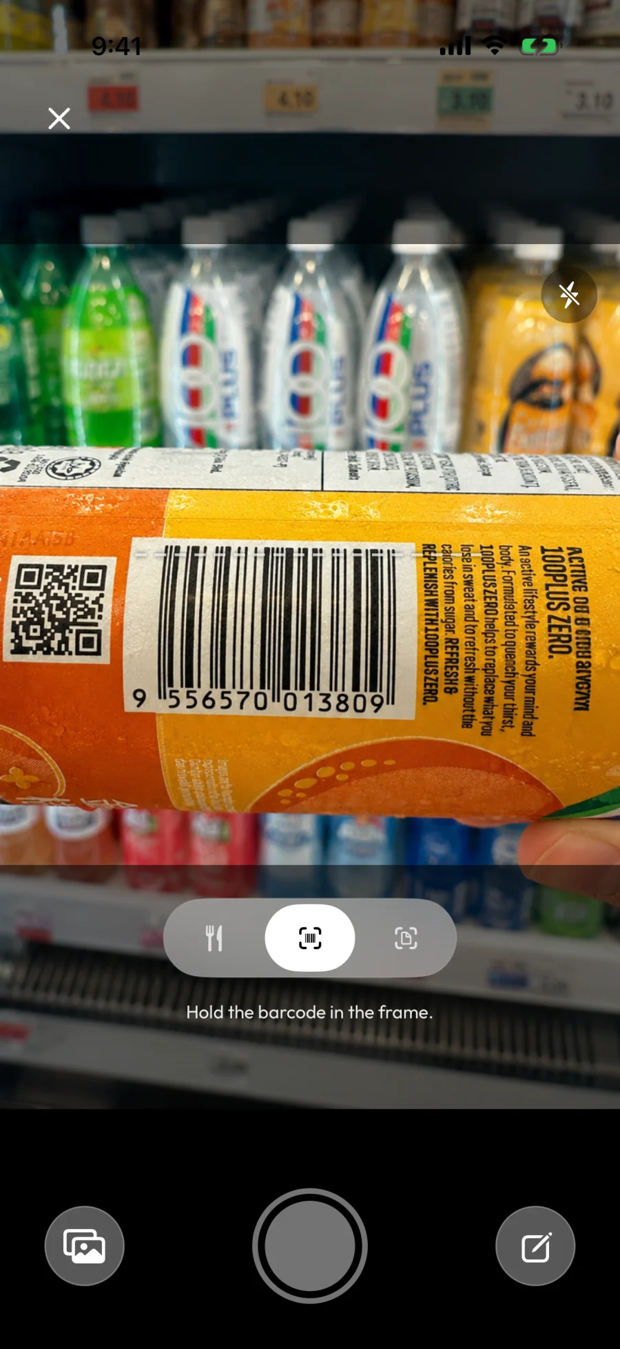 The Barcode scanner: an orange juice bottle's EAN-13 barcode framed in the viewfinder, with the "Hold the barcode in the frame." prompt